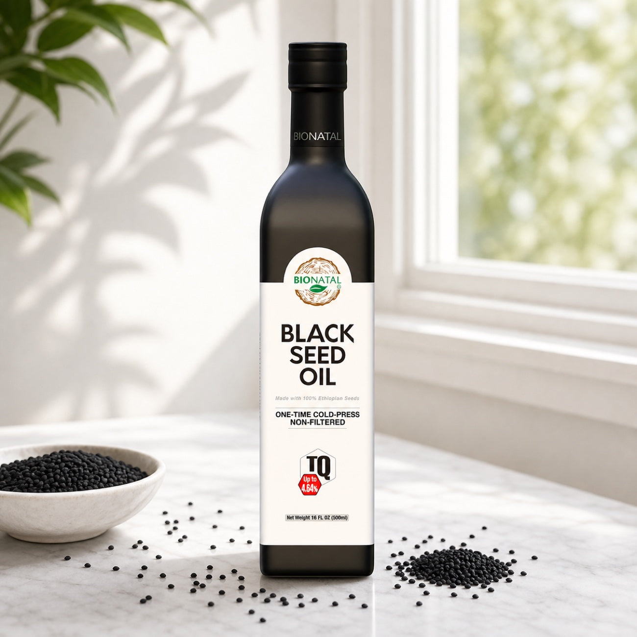 16 oz BioNatal black seed oil glass bottle near a sunny window